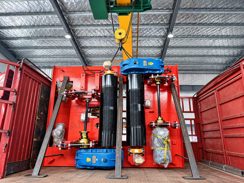 Main and auxiliary hoists on a 10/5-tonne open winch trolley during workshop handling